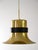 Golden metal pendant lamp with black band detail, dating back to the 1960s. The elegant and particular design, combined...