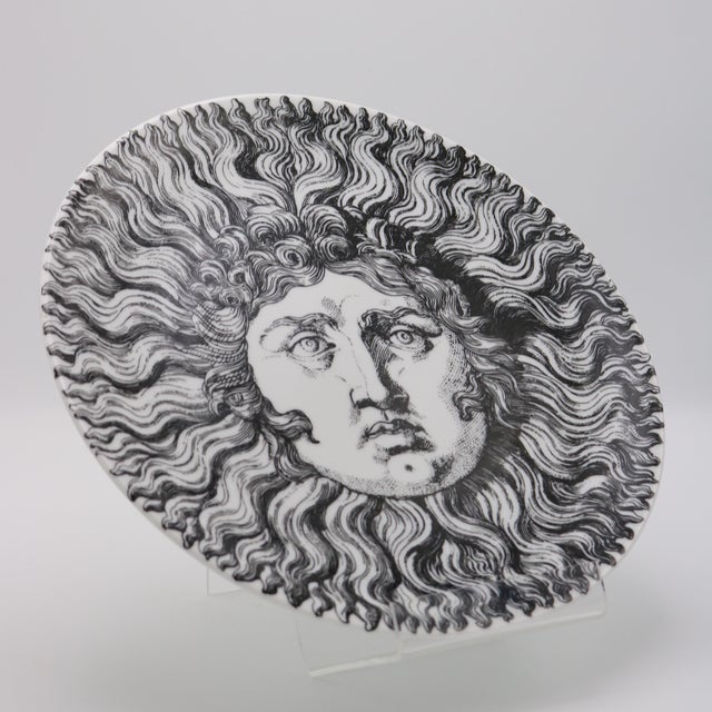 Re Sole' Barnaba Fornasetti large plate. Made by Fornasetti, Milan Porcelain, white, glazed, black and white lithographed...