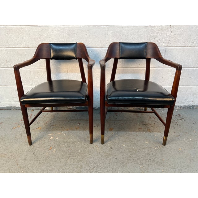 Bring timeless mid-century style to your dining space with this handsome pair of vintage dining chairs by Paoli. Crafted...