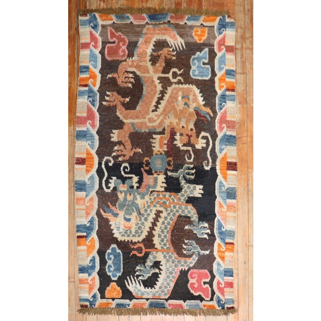 1st Quarter of the 20th century Tibetan rug with a large-scale dragon motif. The wool is soft, Texture and patina are...