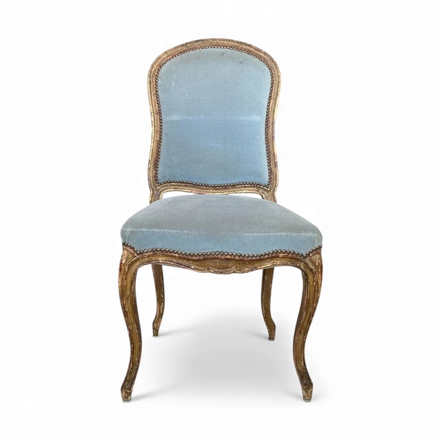 A 19th-century French antique set of four Louis XV chairs, featuring elegantly curved frames, cabriole legs, and finely...
