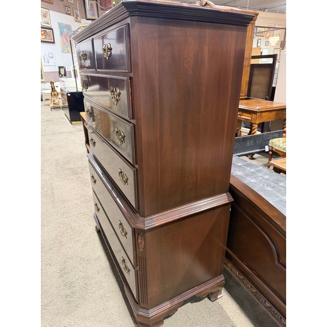 Timeless and refined, this Ethan Allen cherry wood tall chest showcases classic American craftsmanship and enduring style....