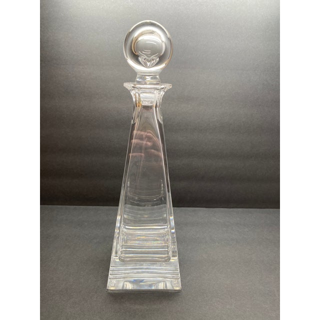 Tiffany & Co. crystal decanter from the Frank Lloyd Wright–inspired series. Tall form with vertical fluting and a stepped...