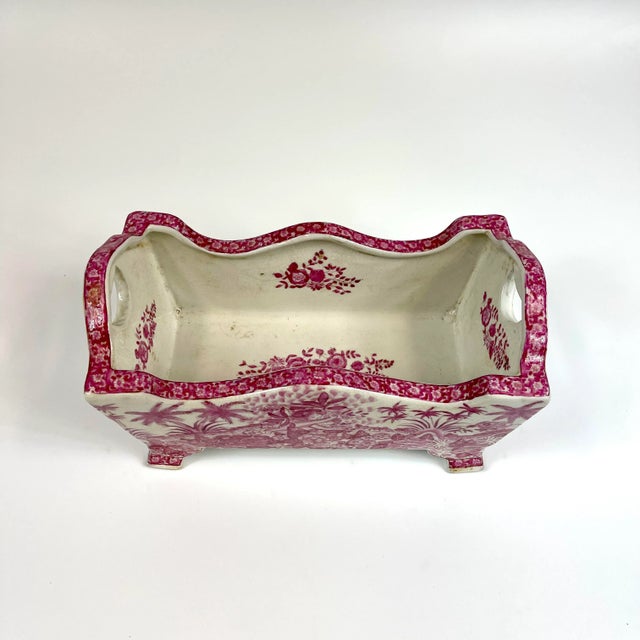 Completely hand painted no decals used) on this chinoiserie style tray. The images depict cherubs and tropical scenery