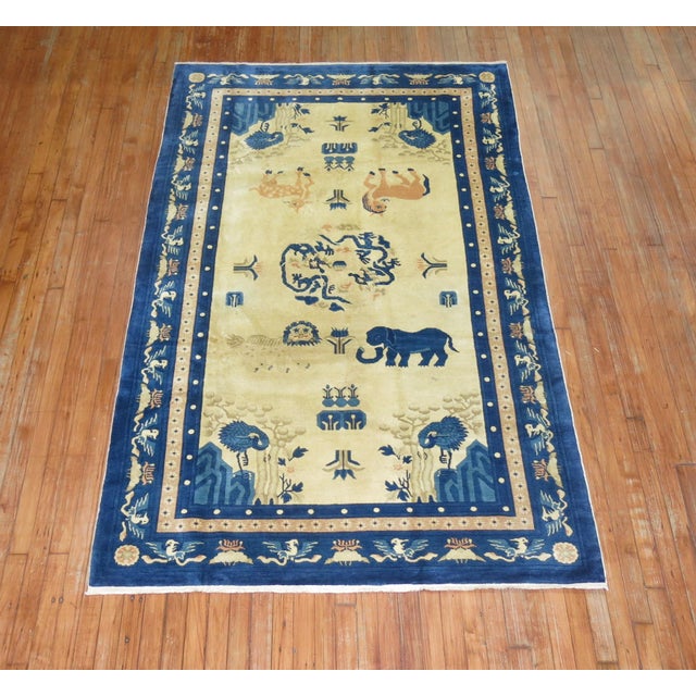 An early 20th century fine quality Chinese animal pictorial rug featuring an anonymous blue elephant. 4'9'' x 7'8''...