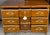 Hand gilded details elevate this stunning walnut dresser/chest by Scott Thomas. Features seven dovetailed drawers (only...