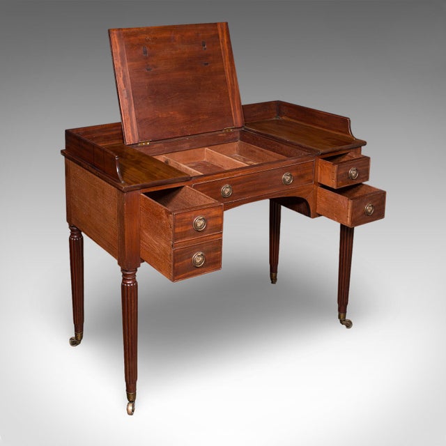 This is an antique writing table. An English, mahogany scribe’s desk, dating to the Regency period, circa 1820. A superbly...