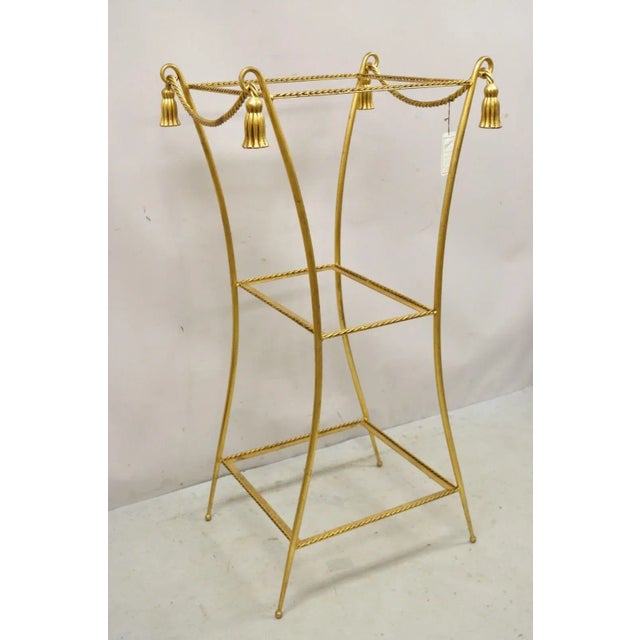 Vintage Italian Hollywood Regency Iron Rope Tassel Gold 3 Tier Display Curio Stand Pedestal. Item features tassel and rope...