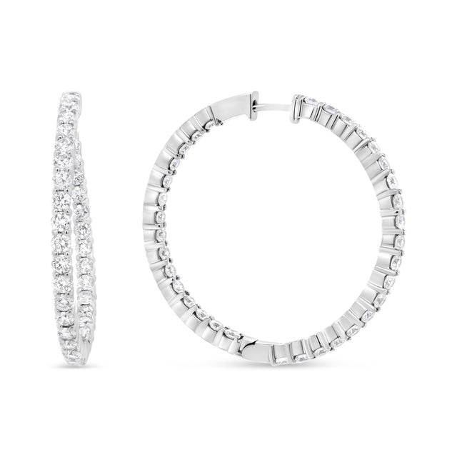 Strike a pose in these gorgeous inside-outside hoop earrings that radiate the luminosity of sparkling prong-set round...