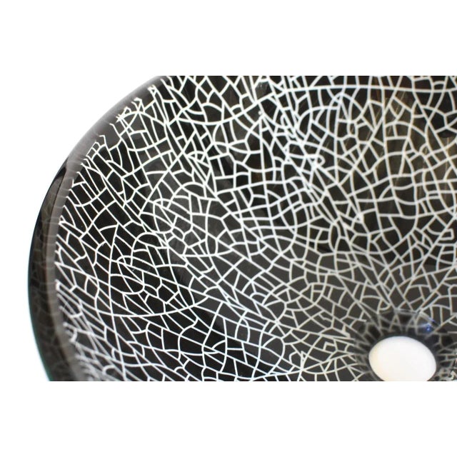 Beautiful black and white glass sink with a crackle pattern. The sink is heavy and substantial, rings like crystal. The...
