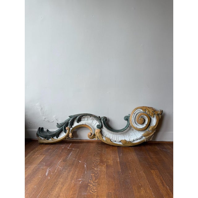 This 18th Century artifact is an exquisite wall sculpture featuring an ornate antique scroll motif. Crafted to evoke...