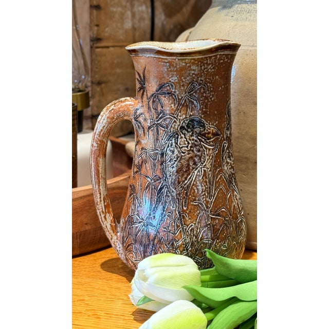 This rare Martin Brothers pottery pitcher is a striking late 19th-century example of the celebrated English pottery...