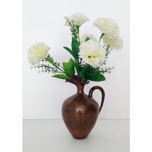 Made in Italy, 1950s. This pitcher vase is made in embossed copper. Its minimal and classical, but still modern. Its...