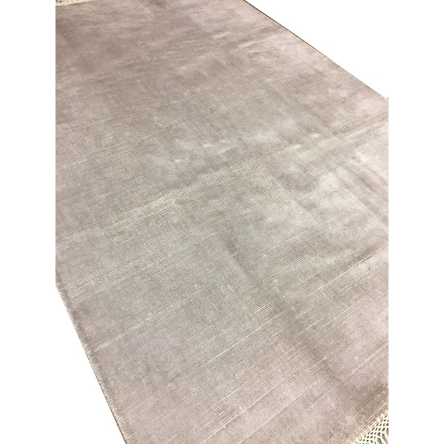 This wonderful new rug is in grey with the end fringes complimenting the rug in ivory to create this special look. Hand...