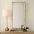 The Cyprus Mirror Showcases A White Faux Shagreen Leather Wrap Featuring Brass Plated Steel Bands That Help Elevate This...