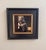 The painting captures a musician in a moment of introspection, seated in a dimly lit backstage area, his focus directed...