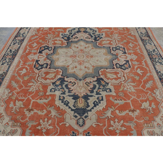 Hand-knotted in wool circa 1880–1890, this 8x12 antique Persian Heriz rug is a striking example of the bold geometry and...