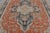 Hand-knotted in wool circa 1880–1890, this 8x12 antique Persian Heriz rug is a striking example of the bold geometry and...