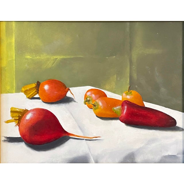 This artwork features a harmonious arrangement of vibrant peppers and beets, their rich colors set against a softly lit...