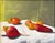 This artwork features a harmonious arrangement of vibrant peppers and beets, their rich colors set against a softly lit...