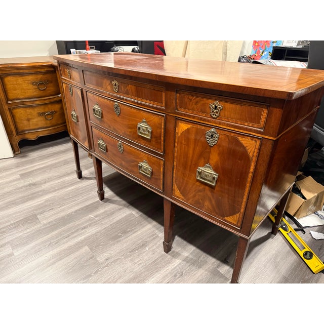 C. 1780 Hepplewhite Mahogany Sideboard With Satinwood Inlay. It’s a beautiful and historic piece.
