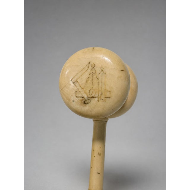 A finely turned ceremonial gavel fashioned from polished organic material, comprising a substantial double-faced head...