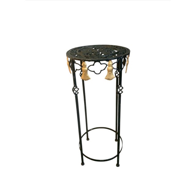 Elegant set of 3 plant stands black iron turned legs with pierced tops and gold metal tassels 27” tallest 19” medium 14”...