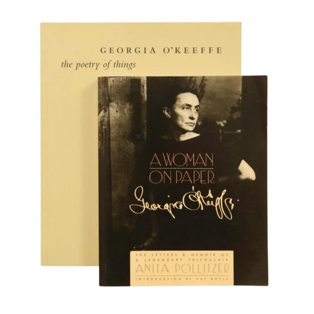 Two Georgia O'Keeffe softcover books. A Woman on Paper, published in 1988, 294 pages. The Poetry of Things, published in...