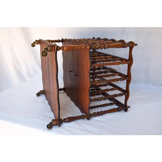 A good quality English Magazine Rack having four slatted divisions. Turned spindles with an additional shelf below....