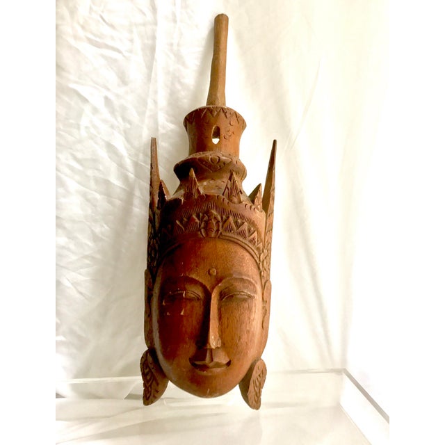 Gorgeous hand carved teak Buddha head wall art. Buddha is crowned. The piece has some minor scratching that acts as...