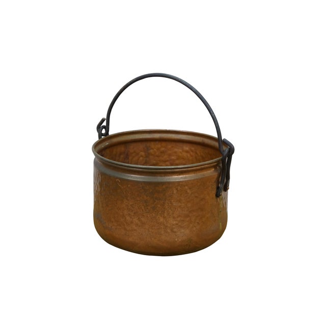 Late 19th to early 20th century dovetailed copper cooking pot with rotating rattail bail handle. Dimensions: 8.5" x 6.5"...