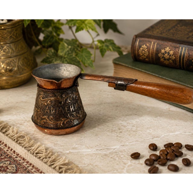 Vintage Armenian miniature copper cezve / coffee pot featuring embossed decorative scrollwork and Cyrillic “АРМЕНИЯ”...