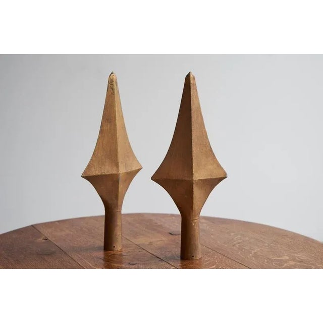 This is a very desirable pair of gold painted finials from a 19th century building. Wonderful interesting shape and...