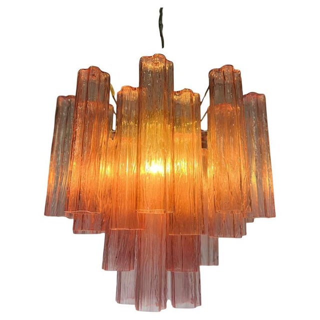 Trio Italian vintage chandeliers in Pink Murano glass and nickel-plated metal structure. The armor polished nickel...