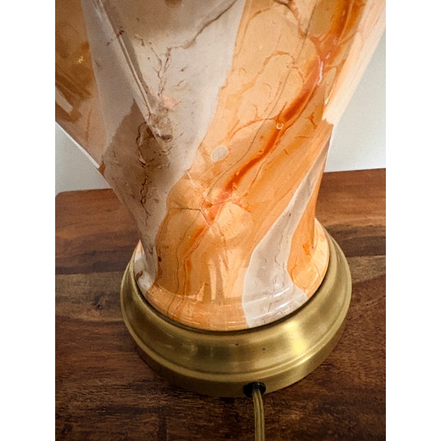 Striking and sculptural, this vintage table lamp features a richly marbled body in warm tones of amber, cream, and soft...