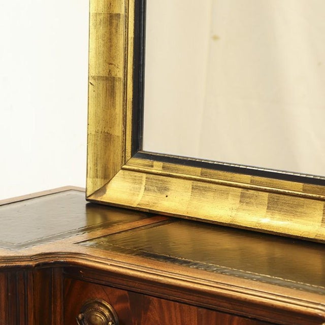 Large antique mirror from the 1920s/1930s. The mirror has a simple yet very decorative frame that has been painted in a...