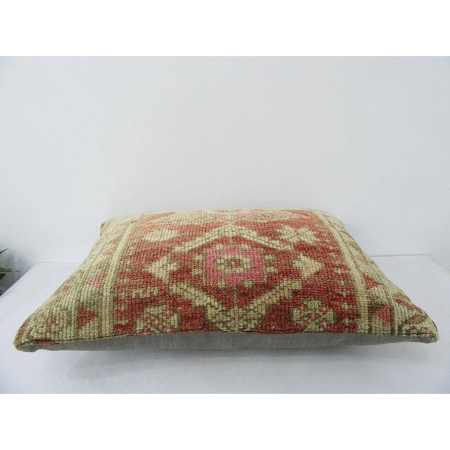 Decorative pillow cover made from a vintage Turkish handknotted rug. Backed with good quality cotton fabric. Pillow...