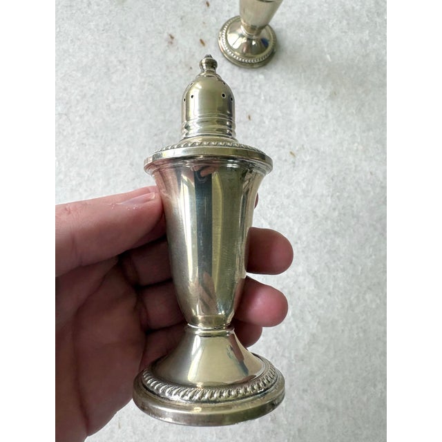 Lovely pair of vintage sterling silver salt and pepper shakers.