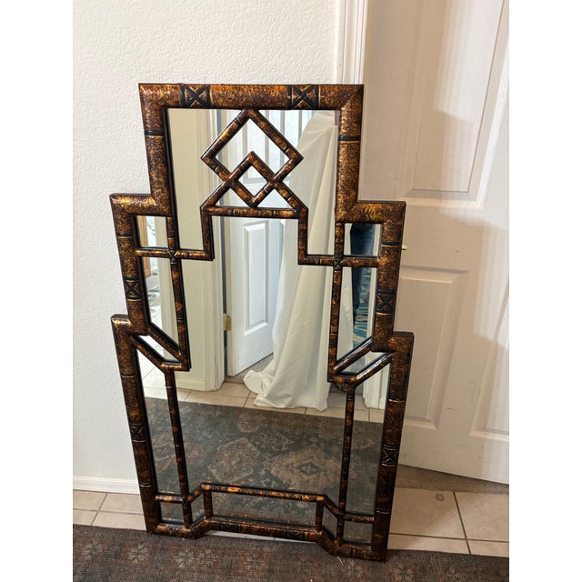 A wonderful addition to your entryway or any wall. The mirror has a stunning faux tortoise shell finish embraces the...