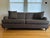 This English roll arm Baker sofa is upholstered in a chocolate chenille fabric. This neutral brown with a textured look is...