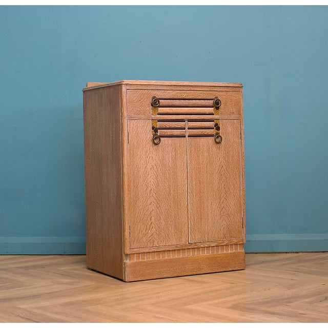 This quality vintage limed oak tallboy chest, circa 1930s. Inside there's a cupboard with a shelf, and a drawer to the top...