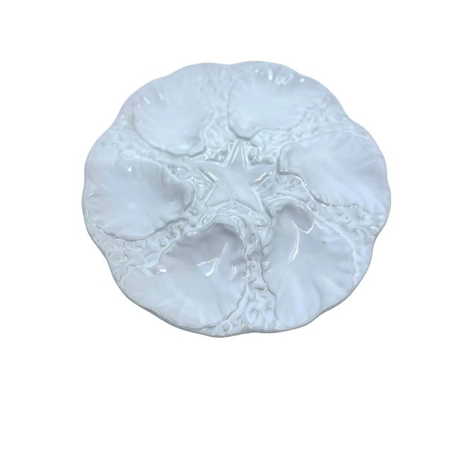 Vintage oyster plate. Perfect for decorative display or even serving. Center star design. White and off white Oyster Plate...