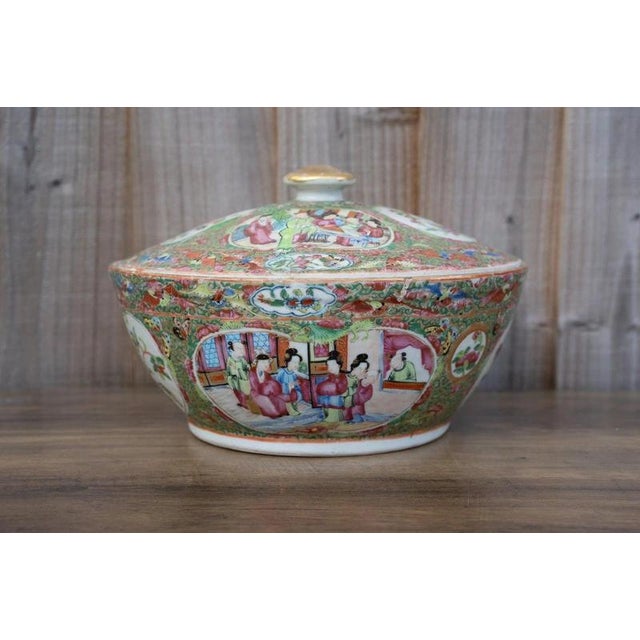 A substantial antique Chinese famille rose Canton porcelain covered bowl dating to the second half of the 19th century,...