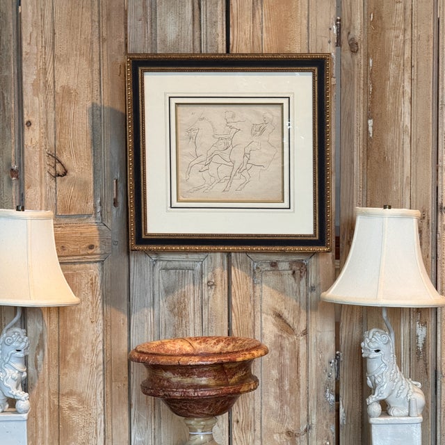 A line engraving of a rider on horseback with a second figure alongside, rendered in a spare, linear style. Numbered "25"...