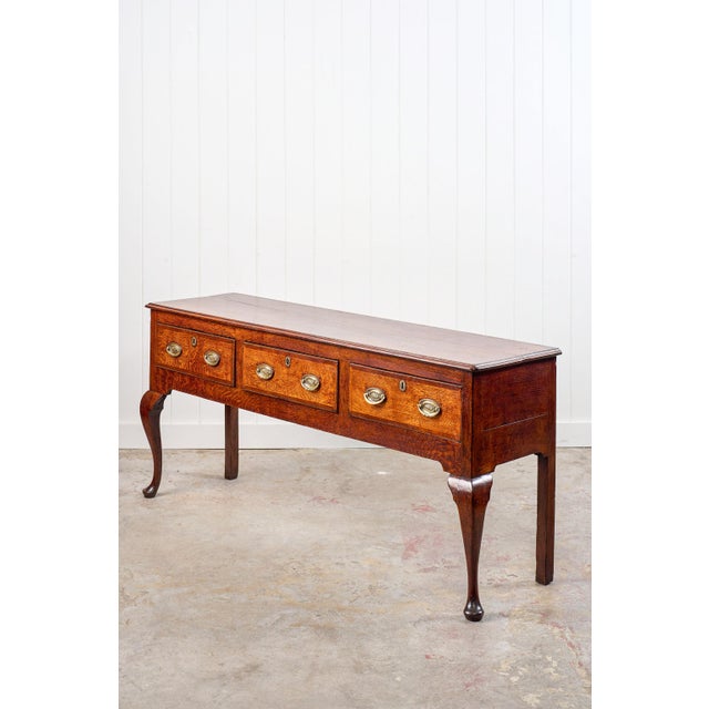 This Late 18th Century Tiger Oak Dresser (c. 1790) showcases richly grained tiger oak with a honey patina. It's finely...