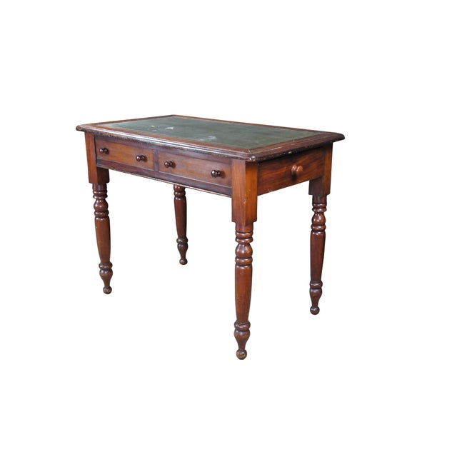 An exceptional early 19th Century William IV Writing Table. Features a rectangular form with green tooled leather inset...