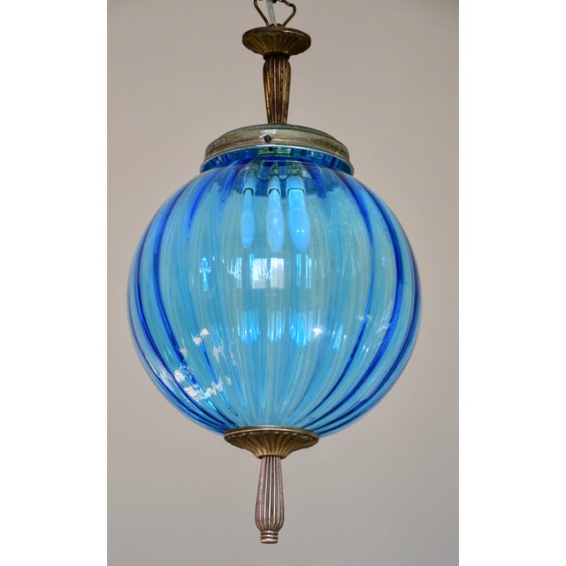 Extraordinary vintage pendant in blue Murano glass. Design period: 1960. The chain has been replaced, the upper and lower...