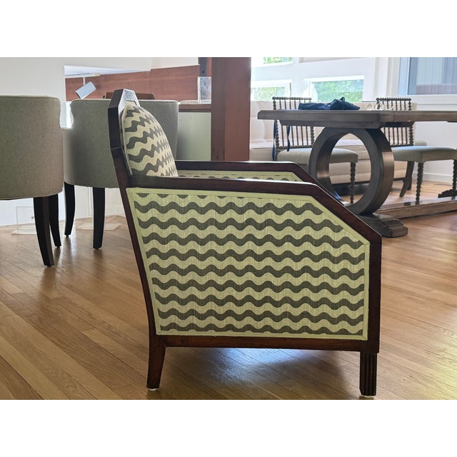 Pair of accent chairs featuring a rich dark wood frame and "rich-rac"-pattern upholstery in neutral tones. Art Deco-...