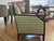 Pair of accent chairs featuring a rich dark wood frame and "rich-rac"-pattern upholstery in neutral tones. Art Deco-...