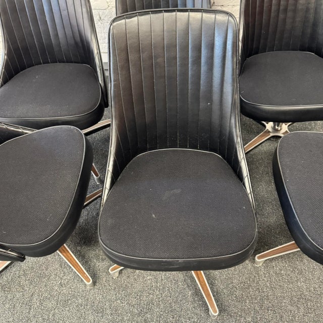 Set of 6 period perfect 1960s Chromcraft lounge chairs. This set wears its original black vinyl, with seats raised on cast...